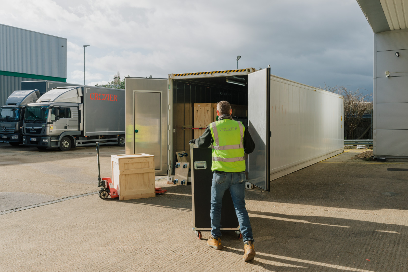 A Crozier technician carefully loads crates into a truck